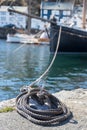 Swirled Curled Rope Boat Bow Line Nautical Tie Down on a old wood sailboat