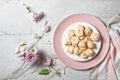 Swirled meringue cookies with caramelized walnuts of egg whites whipped with sugar Royalty Free Stock Photo