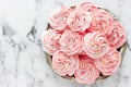 Swirled pink meringue with coloured sugar sprinkles Royalty Free Stock Photo