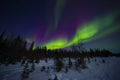 Swirling Bands of Red and Green Aurora Northern Lights Royalty Free Stock Photo