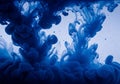 Swirling blue ink clouds through clear Royalty Free Stock Photo