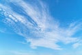 Swirling cirrus clouds in a blue sky. Royalty Free Stock Photo