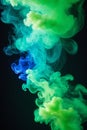 Swirling of dense smoke with green and blue lighting on dark background abstract art Royalty Free Stock Photo