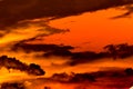 Swirling evening clouds illuminated by the setting sun Royalty Free Stock Photo