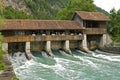 Swirling mass of river water below historic sluice