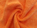 Swirling orange microfiber cloth background