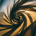 A swirling pattern of fabric creates a spiral design. The fabric is arranged in a circular Royalty Free Stock Photo