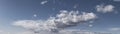 Swirling silver clouds sweeping across city, panorama Royalty Free Stock Photo