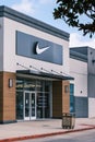 The Swish Logo Looms Over the Entrance to the Nike Store in the Elmwood Shopping Center