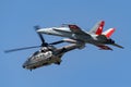 Swiss Air Force Aerospatiale AS532 TH98 military utility helicopter T-340 leading a Swiss Air Force McDonnell Douglas F/A-18C Ho