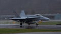 Swiss Air Force fighter jet takes off in the rain. Panning, blurred background Royalty Free Stock Photo