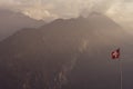 Swiss Alps flag and mountain backdrop