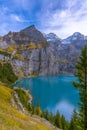 Swiss Alps, Kandersteg, Lake Oeschinensee, Bernese Oberland, Europe. A scenic depiction of a popular tourist attraction.