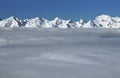 Swiss alps with layer of clouds Royalty Free Stock Photo