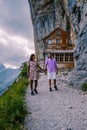 Swiss Alps and a mountain restaurant under the Aescher cliff viewed from mountain Ebenalp in the Appenzell region in Royalty Free Stock Photo