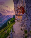 Swiss Alps mountain restaurant Aescher cliff mountain Ebenalp in the Appenzell region in Switzerland Royalty Free Stock Photo
