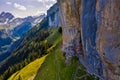 Swiss Alps and a restaurant under a cliff on mountain Ebenalp in Switzerland Royalty Free Stock Photo