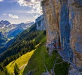 Swiss Alps and a restaurant under a cliff on mountain Ebenalp in Switzerland Royalty Free Stock Photo