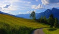 Swiss alps beautiful mountains with green meadow with blue sky and clouds Royalty Free Stock Photo