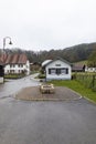 Swiss Alps village in Canton Jura with characteristic houses on a cloudy day