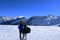 Swiss alps: A young couple walking over the snow at MÃÂ¶nchshut above Grindelwald/Interlaken Royalty Free Stock Photo