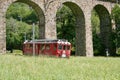 Swiss Bernina express train at the Brusio Circular Viaduct Royalty Free Stock Photo