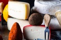 Swiss cheese belper knolle. Assortment of cheese. Cheese knife. Organic product. Black Pepper. italian appetizer.