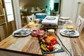 Swiss or Dutch raclette table filled with ingredients for a celebratory evening like Christmas or New Years Eve