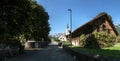 Swiss farmhouse and the Flums church of Saint Laurence