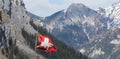 swiss flag in front of the alps Royalty Free Stock Photo
