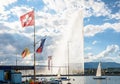 The Swiss flag and the Jet d`Eau water jet on the Lake Geneva Royalty Free Stock Photo