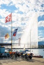 The Swiss flag and the Jet d`Eau water jet on the Lake Geneva in Geneva, Switzerland Royalty Free Stock Photo