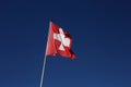 Swiss Flag Flying during a Windy Day