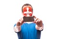 Swiss football fan take selfie photo with phone on white background. Royalty Free Stock Photo