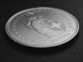 1 Swiss Franc coin close up. Black and white background or backdrop about economy, business or banking. Money and currency of