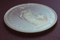 1 Swiss Franc coin close-up. Purple tinted background or wallpaper about economy, business or swissy. Money and Central Bank in Royalty Free Stock Photo