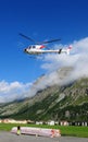 A Swiss Helicopter of Air Engadin is being prepared for the tran