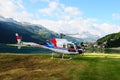 A Swiss Helicopter at glacier lake Silvaplana in the upper Engadin