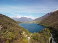 Swiss mountain lake in summer surrounded by lush green meadows and alpine peaks. Royalty Free Stock Photo