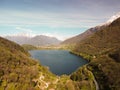 Swiss mountain lake in summer surrounded by lush green meadows and alpine peaks. Royalty Free Stock Photo