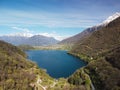 Swiss mountain lake in summer surrounded by lush green meadows and alpine peaks. Royalty Free Stock Photo