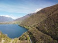 Swiss mountain lake in summer surrounded by lush green meadows and alpine peaks. Royalty Free Stock Photo