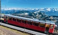 Swiss mountain railways and spring panoramic view of snow-capped mountains in the Alps