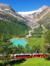 Swiss mountain train Bernina Express crossed Alps with glaciers in the summer