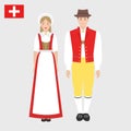 Swiss in national costume with a flag