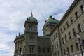 Swiss Parliament Building called Bundeshaus in Berne with swiss flag