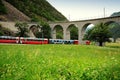 Swiss Red Train Bernina Express at Brusio Viaduct.