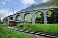 Swiss Red Train Bernina Express at Brusio Viaduct.