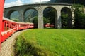 Swiss Red Train Bernina Express at Brusio Viaduct.