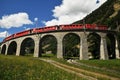 Swiss Red Train Bernina Express at Brusio Viaduct.